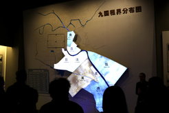 Figure 1: Visitors observe the map of foreign concessions at the Tianjin Historical Museum. The Austro-Hungarian concession is at the top of the highlighted section, marked green.