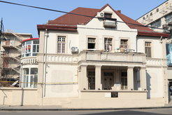 Figure 8: A building in the former Austro-Hungarian concession, still used for residential purposes. The black and white preservation plaque marks it as a historic building. Some residents have used cultural protection status as a way to avoid forced eviction and demolition. Photograph by author.