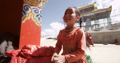 A young pilgrim in a Tibetan location.