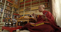 Khenpo Sodargye reads a sutra in his study at Larung Gar Buddhist Academy, summer 2013.