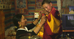 Getting dressed before the pilgrimage to Amne Machen – a still from Ensouling the Mountain.