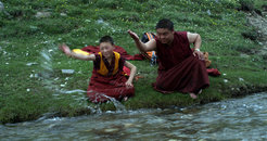 Siddhi Lama and Akha Shamba, his uncle offering the stream to Amne Machen before they drink from it – a still from Ensouling the Mountain.