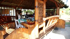 A bamboo hut at the Center for Returning Migrants that serves as a social hub for its members.