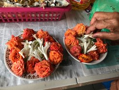 Preparing floral offerings at a temple (Photo: M. Amrith)