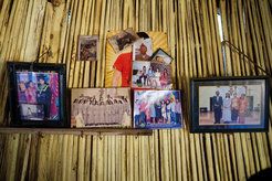 Photos of family near and far in an East Timorese living room, Indonesia
